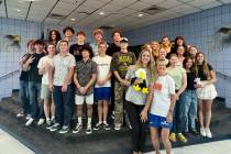 Boys and girls swim team members during their recent team banquet.