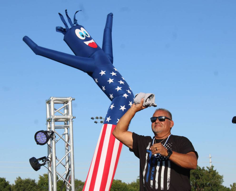 DJ Mike Pacini tosses a T-shirt as he again led the fun at the Veterans Park with his music and ...
