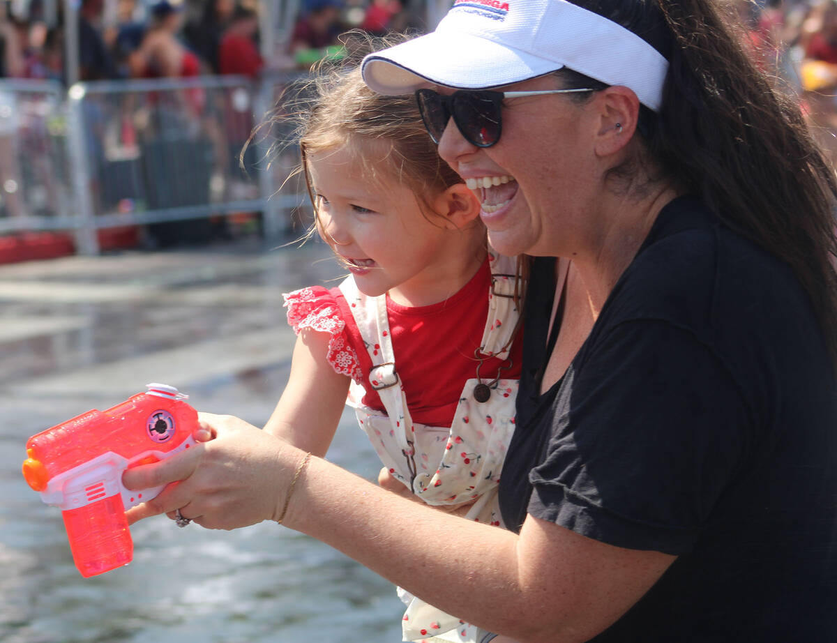 Teaching the next generation all about the parade's wet zone.