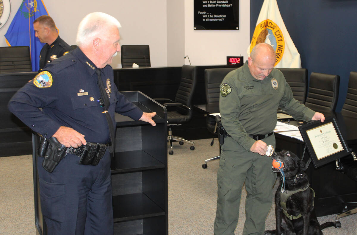 Ron Eland/Boulder City Review K-9 officer Allan Nutzman shows a retirement badge to his K-9, Lu ...