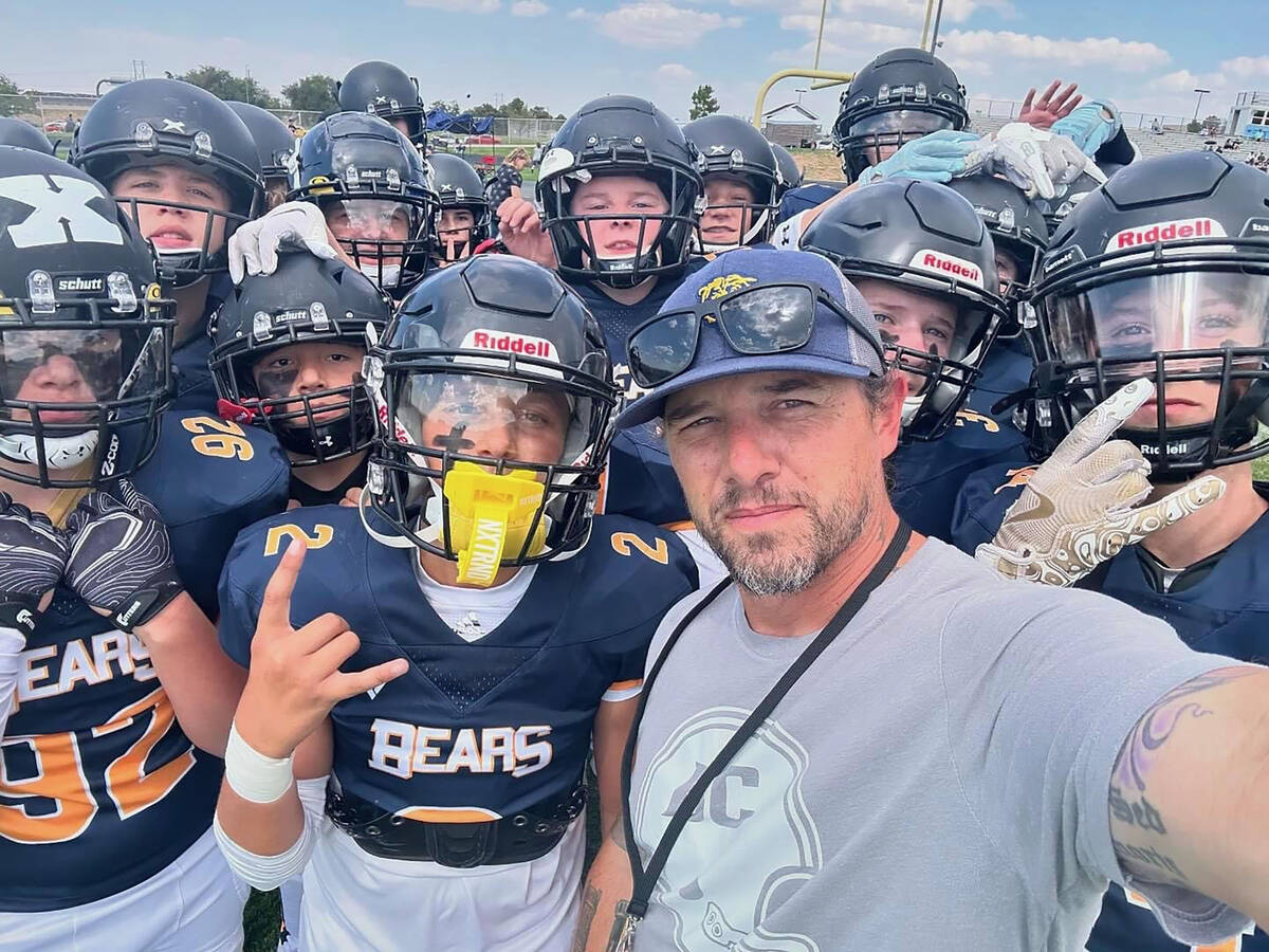 Photos courtesy of James Cracolici Boulder City High School football coach Bubba Mariani with t ...