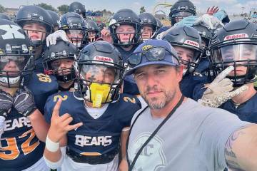 Photos courtesy of James Cracolici Boulder City High School football coach Bubba Mariani with t ...