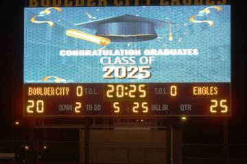 The football field's new scoreboard was able to show a live feed of the ceremony along with eac ...