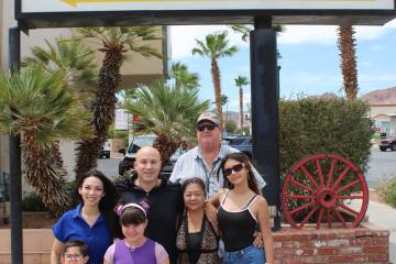 Ron Eland/Boulder City Review Seth and Tammy Grabel (in black and blue) and their kids, Grace a ...