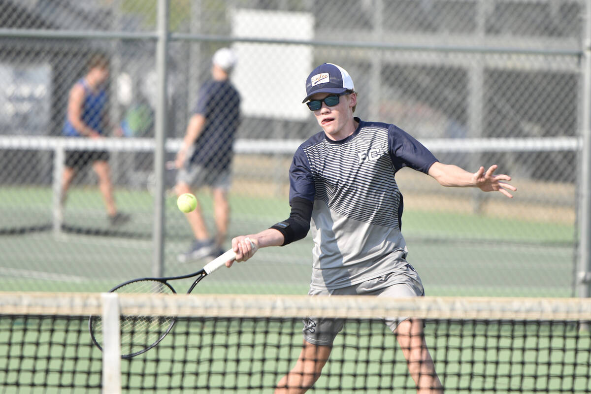Robert Vendettoli/Boulder City Review Logan Borg returns the ball against Basic last season in ...