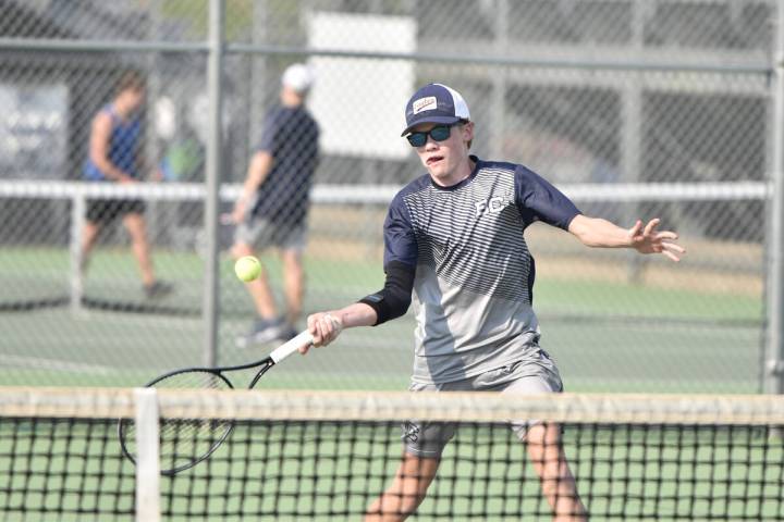 Robert Vendettoli/Boulder City Review Logan Borg returns the ball against Basic last season in ...