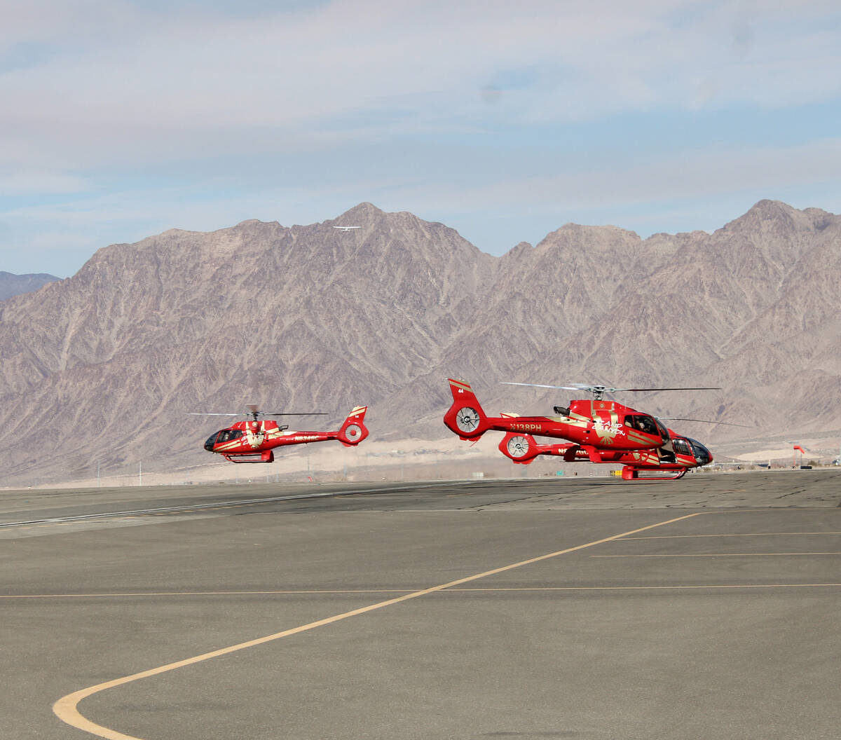 Ron Eland/Boulder City Review A trio of tour helicopters take off from the Boulder City Airport ...