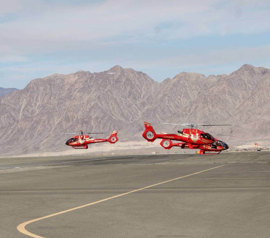 Ron Eland/Boulder City Review A trio of tour helicopters take off from the Boulder City Airport ...