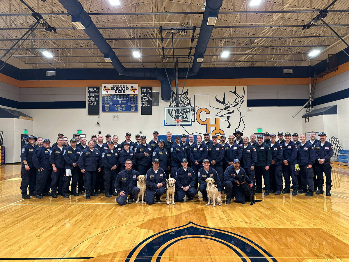 Photo courtesy Nevada Task Force 1 Members of the Nevada Task Force 1 pose inside the high scho ...