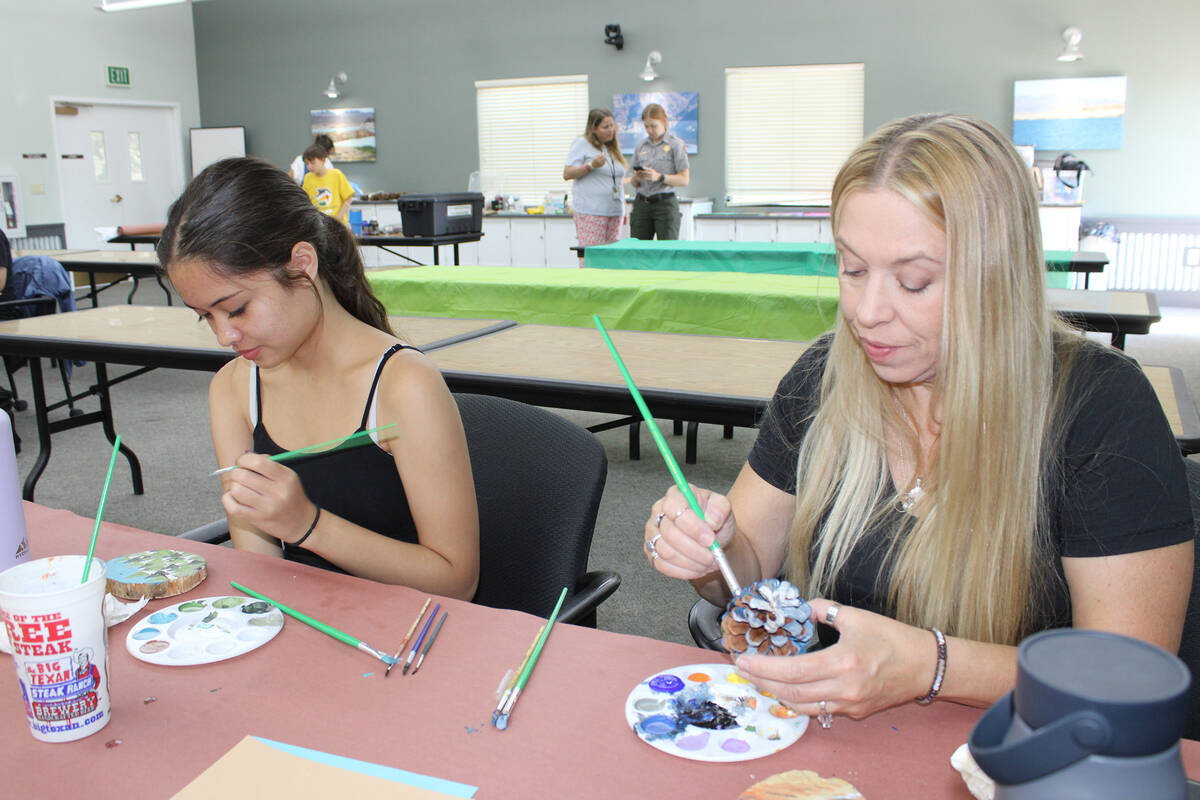 Photos by Ron Eland/Boulder City Review Alannah Wijaya and Jennifer Marsh put the finishing tou ...