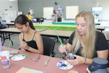Photos by Ron Eland/Boulder City Review Alannah Wijaya and Jennifer Marsh put the finishing tou ...