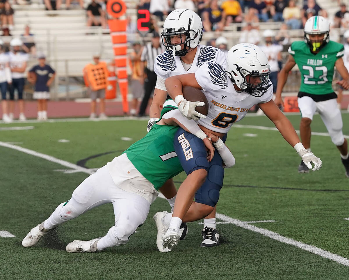 Photo courtesy Thomas Ranson/Lahontan Valley News Boulder City's James Peel tries to break away ...