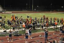 The BCHS marching band and the color guard perform for a full crowd during halftime.