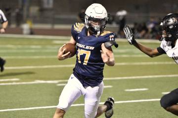 Robert Vendettoli/Boulder City Review Moving the chains, running back Nathaniel Lewis rushes up ...
