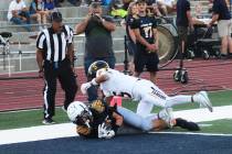 Ron Eland/Boulder City Review Boulder City's Brandon Hobbs hauls in a successful two-point conv ...