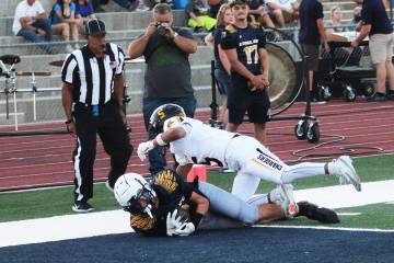 Ron Eland/Boulder City Review Boulder City's Brandon Hobbs hauls in a successful two-point conv ...
