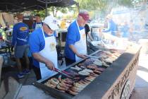 Ron Eland/Boulder City Review file photo Rotarians Roger Hall and Doug Scheppmann help cook up ...