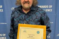 Photo courtesy Linda Evans Boulder City Review staff writer Bill Evans shows his first-place ce ...