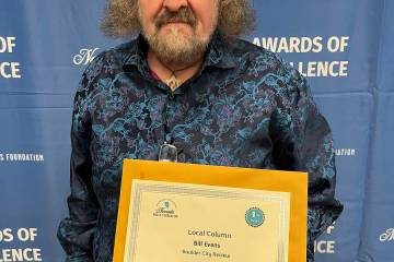 Photo courtesy Linda Evans Boulder City Review staff writer Bill Evans shows his first-place ce ...