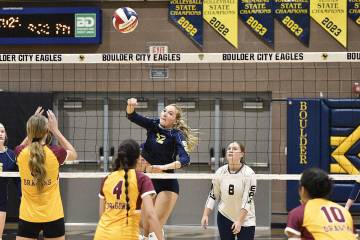 Robert Vendettoli/Boulder City Review Putting points on the board, Kenley Poff spikes the ball ...