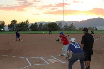 Ron Eland/Boulder City Review file photos The annual National Night Out softball game pitting B ...