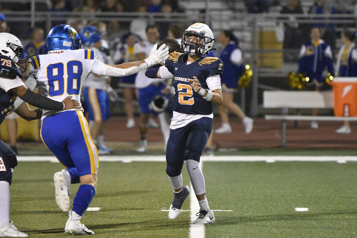 Robert Vendettoli/Boulder City Review Under heavy duress, Eagles quarterback Asa Mariani looks ...