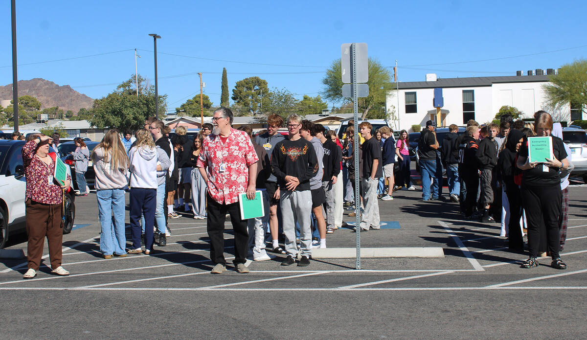 Once students were given permission to come out from under their desks, each class made its way ...
