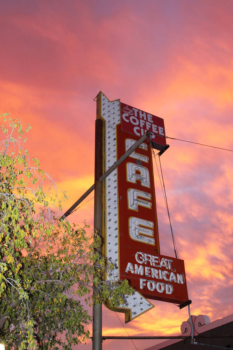 The Coffee Cup sign had quite a backdrop at sunset.