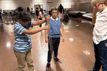 Photo courtesy Jeanne Moody Carl Garcia, Landon Bexley and William Schrock work on a Starbase p ...