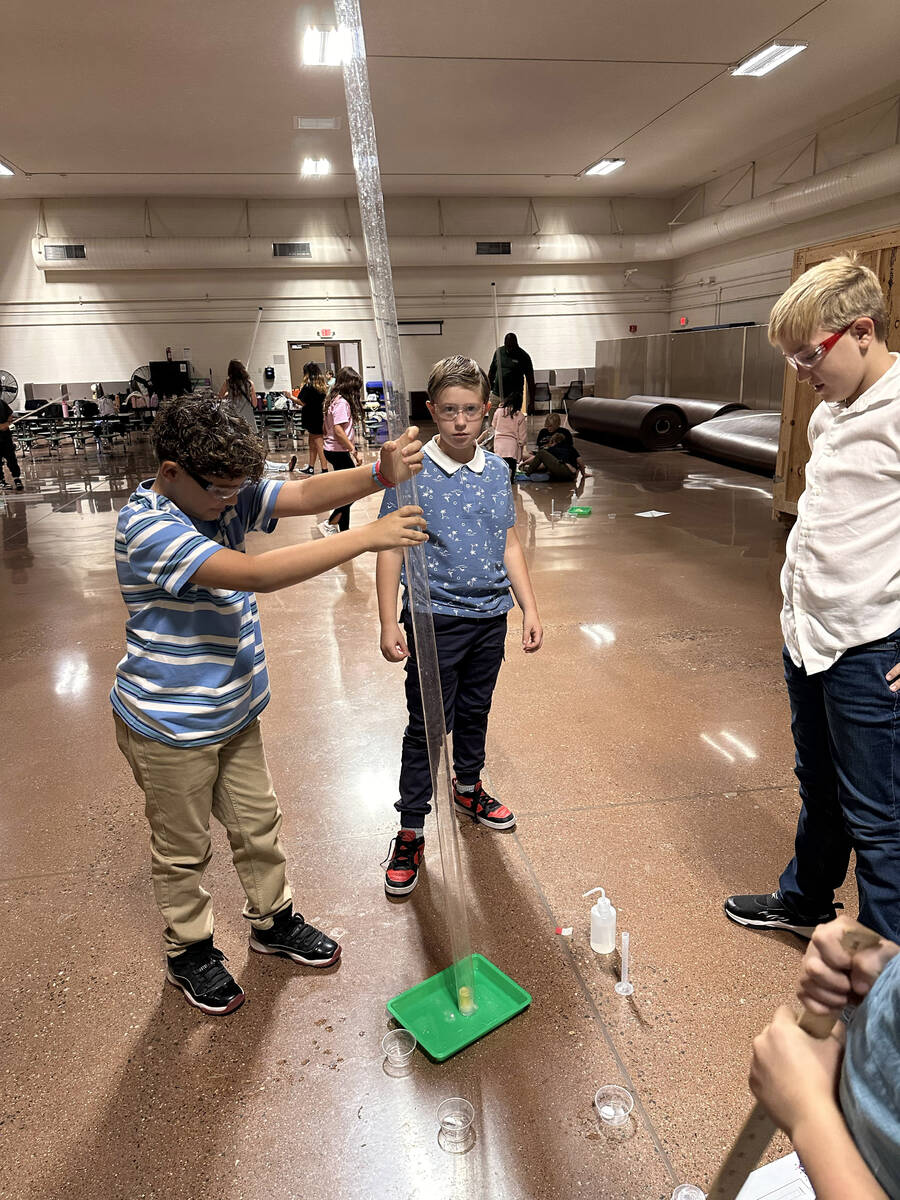 Photo courtesy Jeanne Moody Carl Garcia, Landon Bexley and William Schrock work on a Starbase p ...