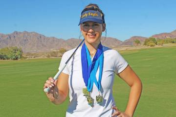 Ron Eland/Boulder City Review BCHS golfer Emmerson Hinds displays her three individual state me ...