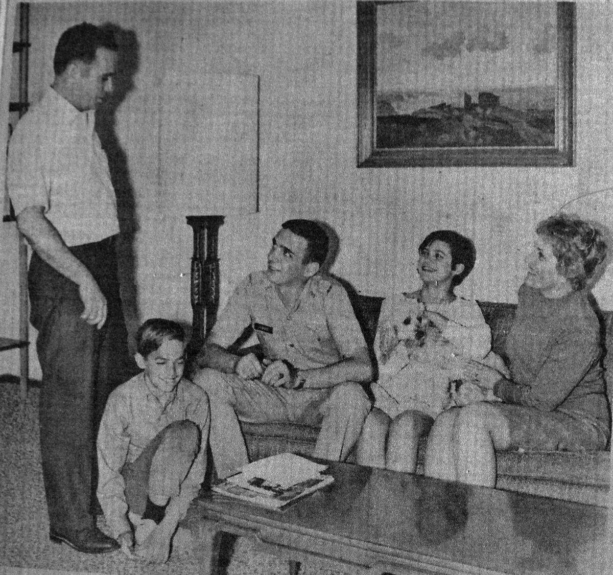 The Las Vegas-Review Journal photo shows Vietnam pilot Richard Gilmore with his parents and sib ...