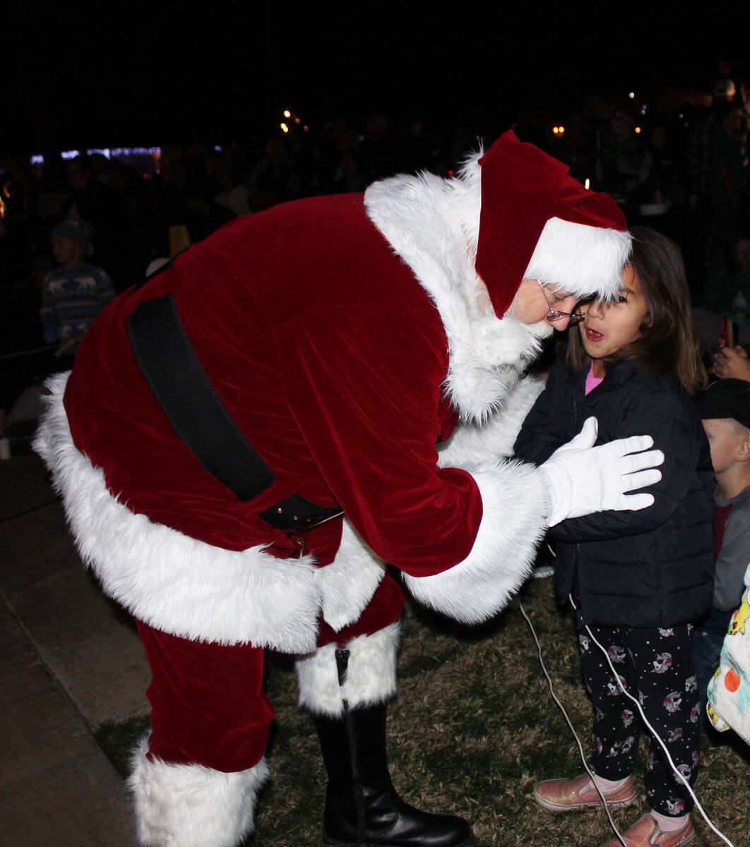 Ron Eland/Review file photo Santa takes a moment to listen to a young girl’s Christmas w ...