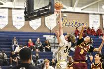 Robert Vendettoli/Boulder City Review Boulder City High School forward Branch Danko puts up a l ...