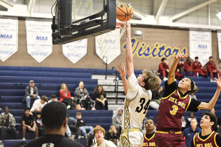 Robert Vendettoli/Boulder City Review Boulder City High School forward Branch Danko puts up a l ...