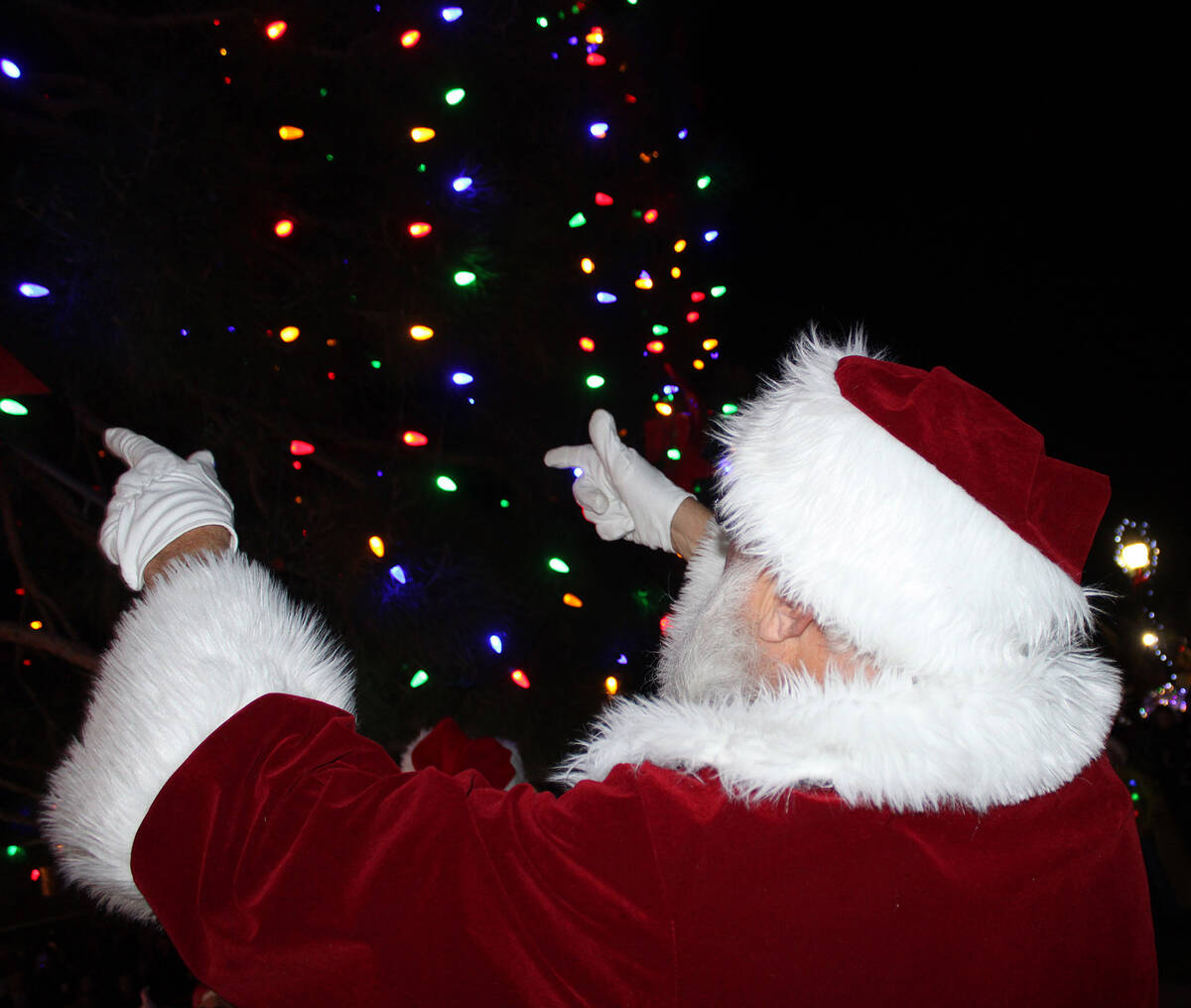 Santa used a bit of his Christmas spirit to help light the Community Christmas Tree in Frank T. ...