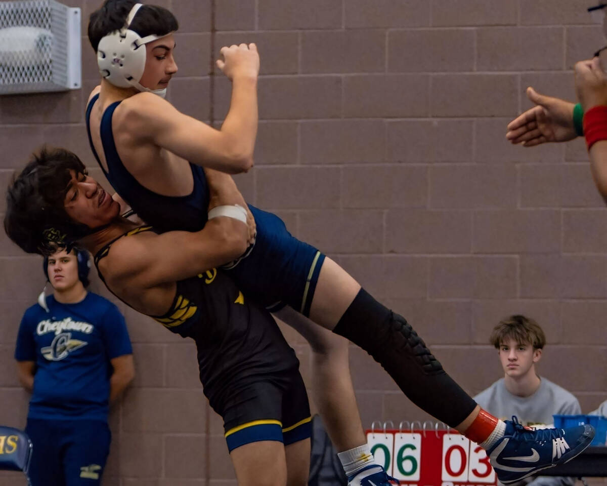 Photo courtesy Catherine Goode Senior Erick Garza lifts his opponent for a slam on Dec. 6 at th ...