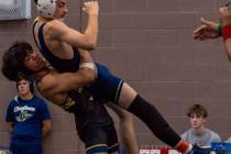 Photo courtesy Catherine Goode Senior Erick Garza lifts his opponent for a slam on Dec. 6 at th ...