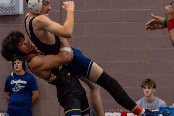 Photo courtesy Catherine Goode Senior Erick Garza lifts his opponent for a slam on Dec. 6 at th ...