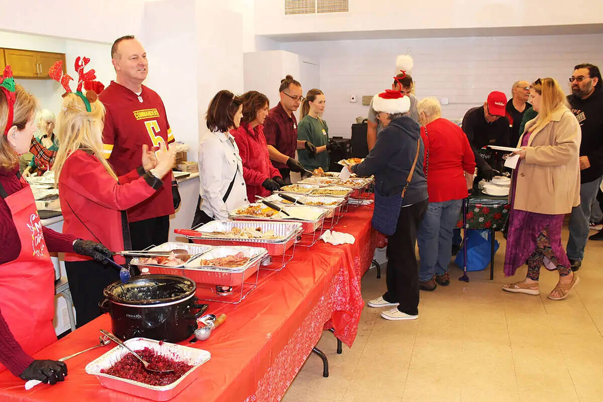 Ron Eland/Review file photo Volunteers at last year's Christmas dinner served nearly 300 p ...