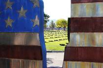 Photos by Ron Eland/Boulder City Review The wreaths can be seen through the metal statue at the ...