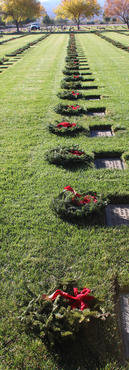 A majority of the gravesites received one of the wreaths, which were purchased by families thro ...