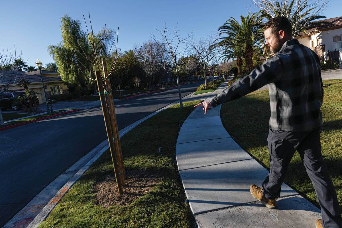Mark Edington, a plaintiff in a lawsuit against the Southern Nevada Water Authority, points to ...