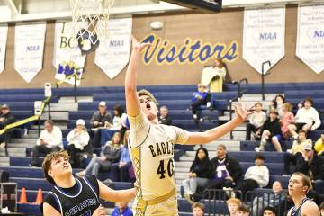 Robert Vendettoli/Boulder City Review Eagles star forward Levi Randall puts a layup off the gla ...