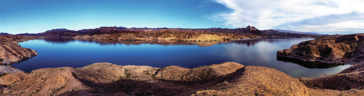 The Colorado River flows along Eldorado Canyon near Nelson's Landing in a combined image as the ...