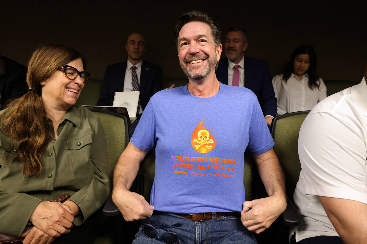 Landscape architect Jay Pleggenkuhle shows a mock Southern Nevada Water Authority T-shirt in th ...