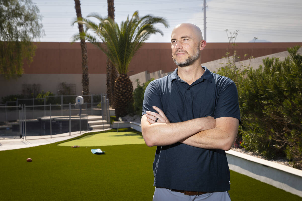 Sam Castor, an attorney at the firm Lex Tecnica, poses for a portrait in the backyard of his ho ...
