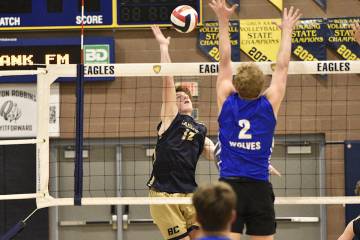 Robert Vendettoli/Boulder City Review Boulder City hitter Miles Alder spikes the ball against B ...