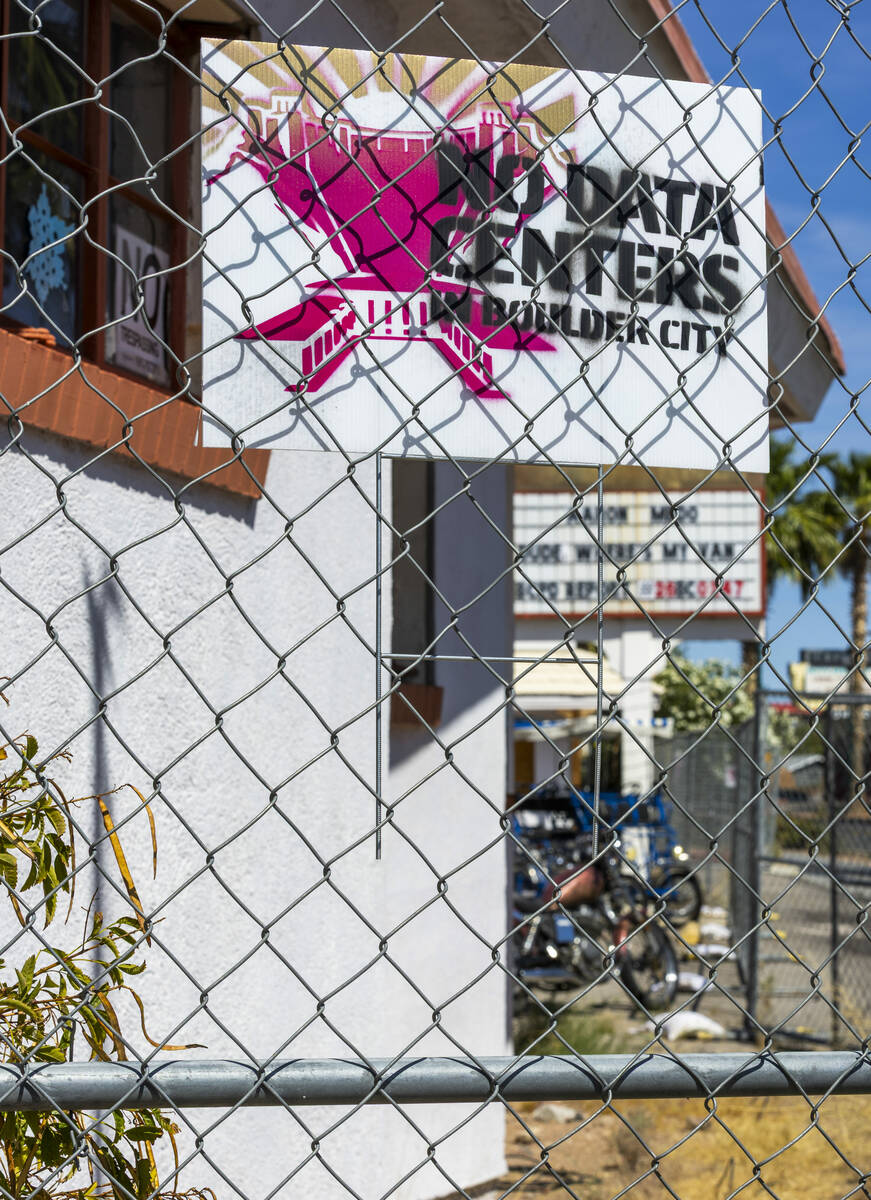 The gated Flamingo Inn Motel has "No Data Centers" signs around it as project represe ...