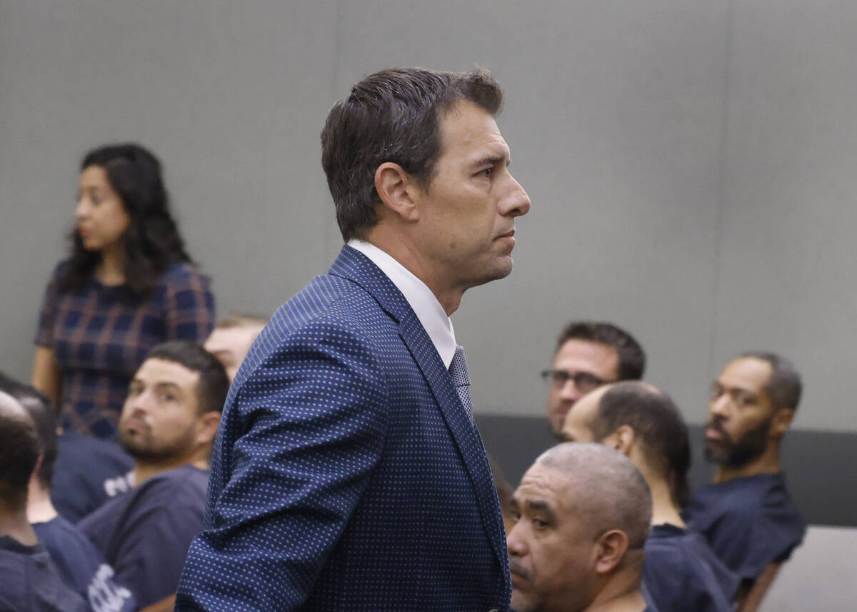 Frank Mariani, center, a former Boulder City High School football coach who is accused of lewdn ...